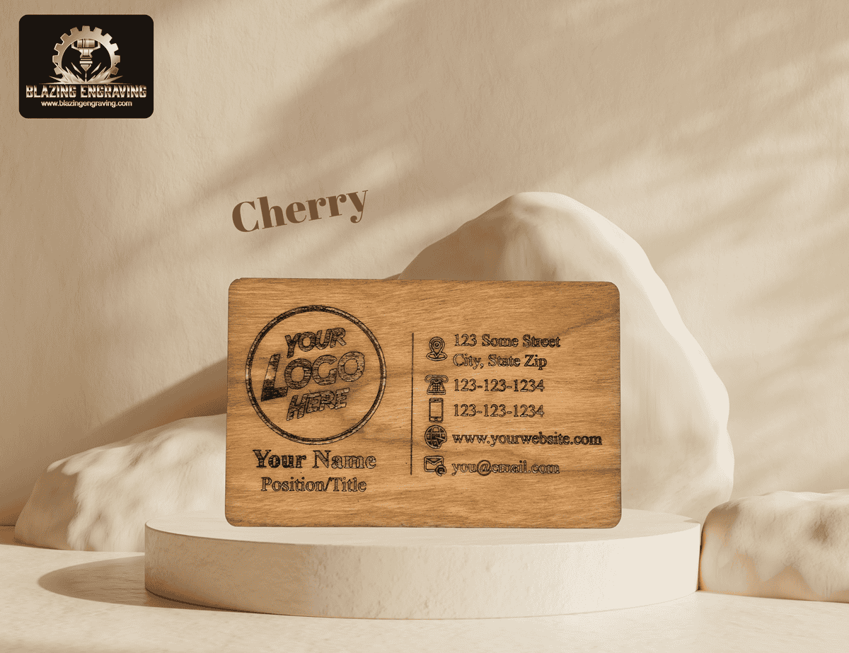 Cherry wood business card from Blazing Engraving, engraved with a customizable contact template, displayed on a cream-colored pedestal with a soft, natural background.