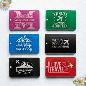 Custom engraved luggage tags in assorted colors and travel-themed designs, including personalized name options.