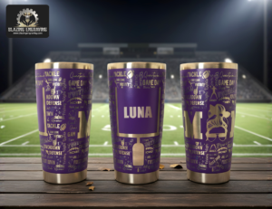 Three stainless steel tumblers showing all sides of a laser-engraved football mom design, personalized with the name "Luna," displayed on a surface with a football stadium and field in the background. Blazing Engraving logo in the top left corner.