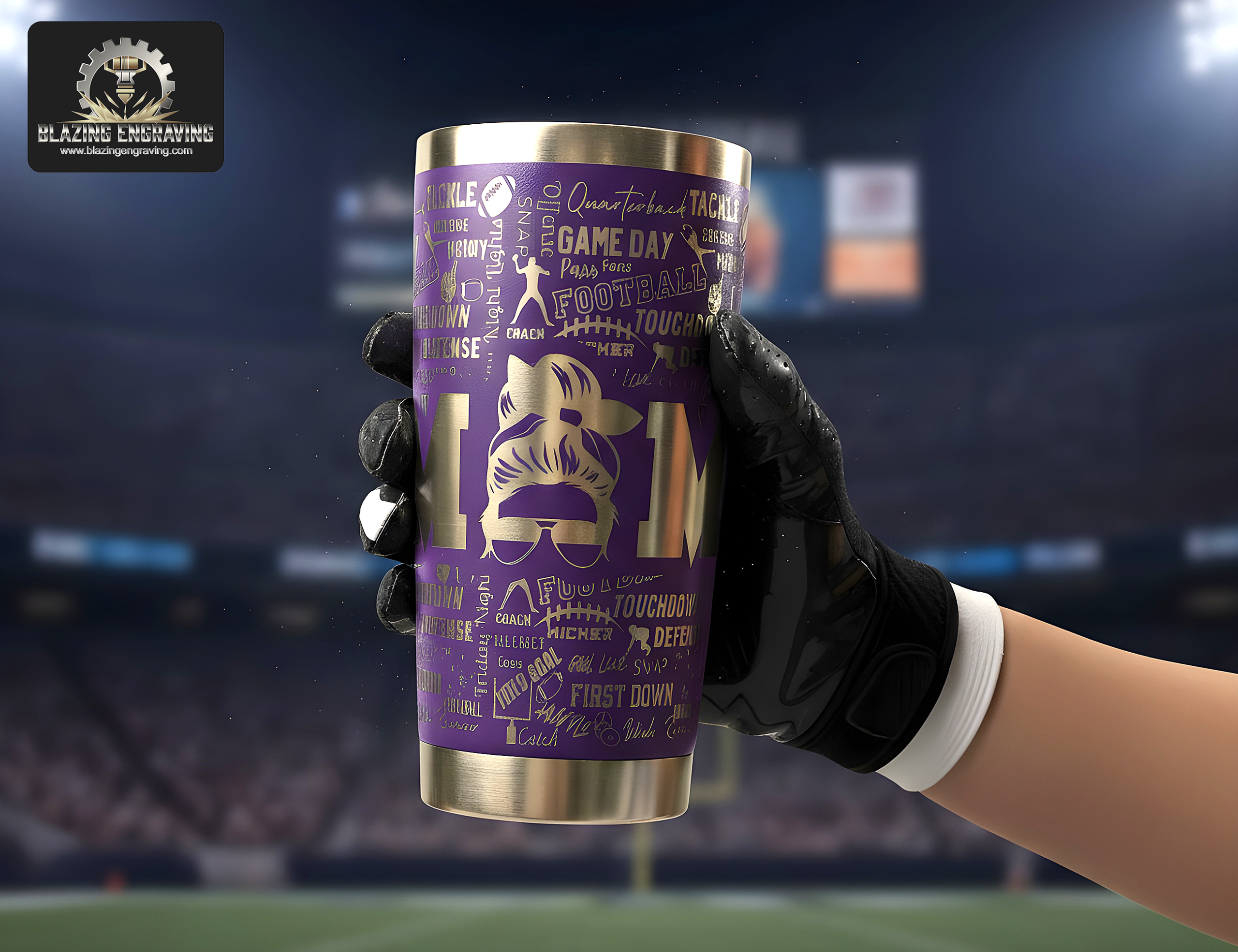A gloved hand holding a stainless steel tumbler with a laser-engraved football mom design featuring a "MOM" figure with a messy bun and football-themed words, with a football stadium in the background. Blazing Engraving logo in the top left corner.